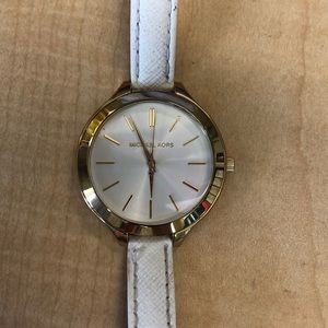 MK white and gold watch.